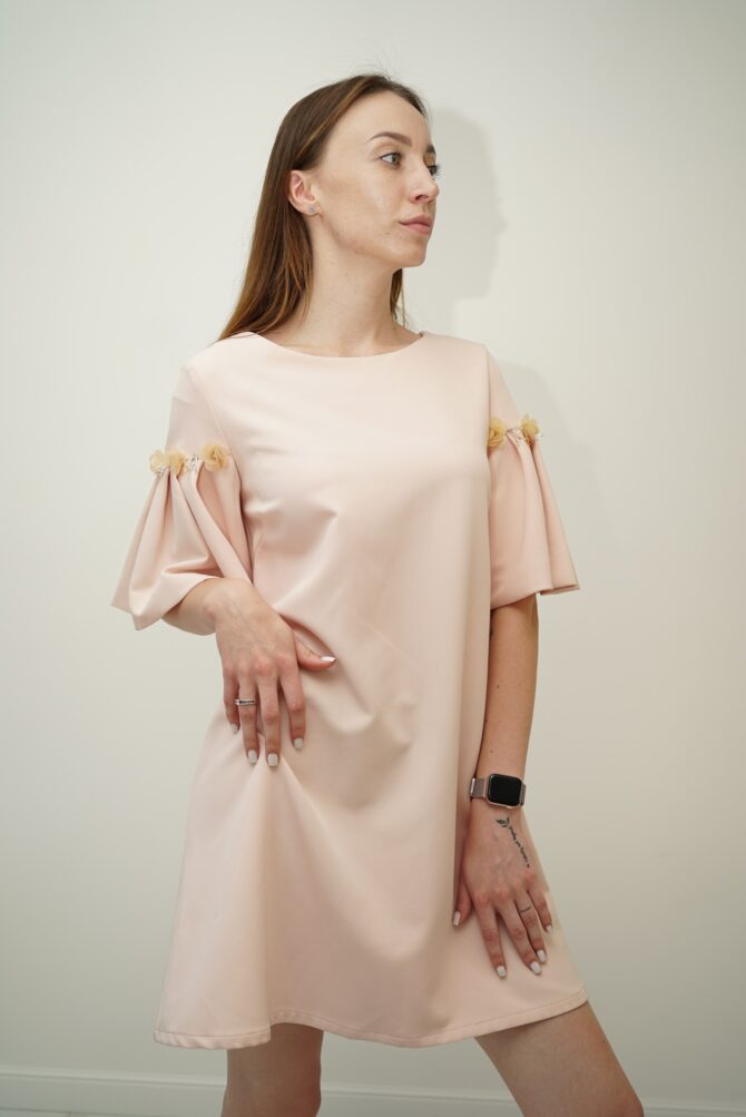 Light pink dress with roses on the sleeves