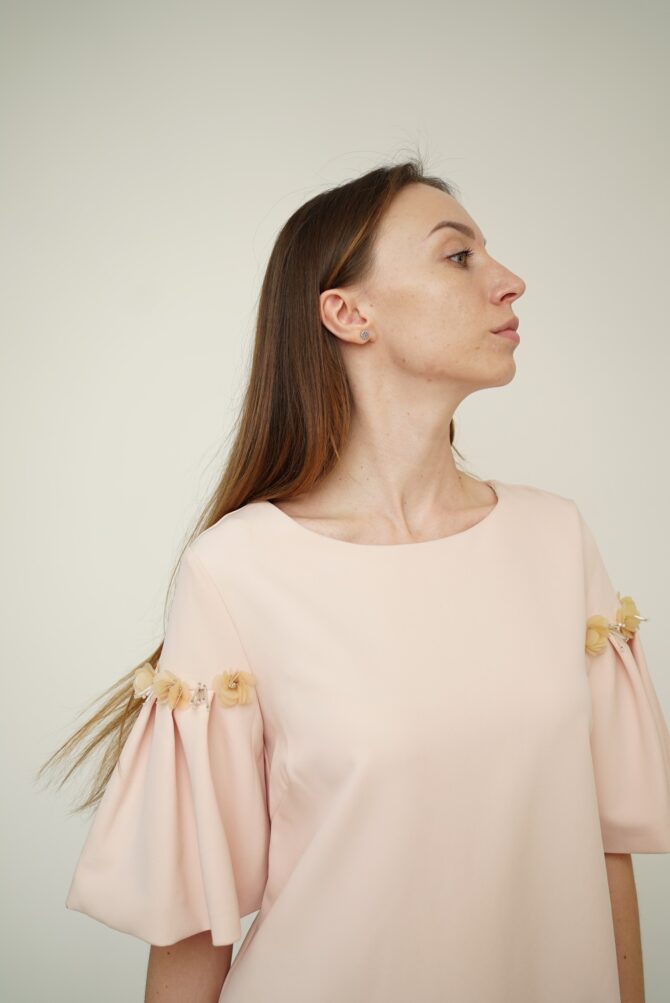 Light pink dress with roses on the sleeves