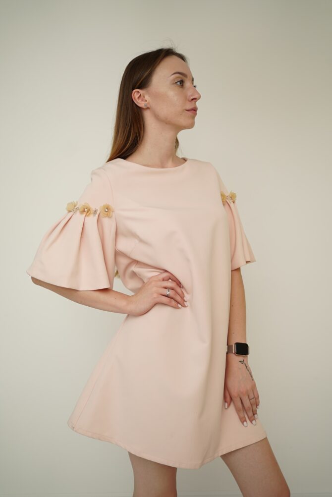 Light pink dress with roses on the sleeves