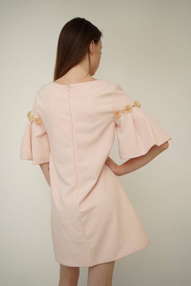 Light pink dress with roses on the sleeves