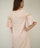 Light pink dress with roses on the sleeves