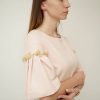 Світло рожева сукня з розочками на рукавах