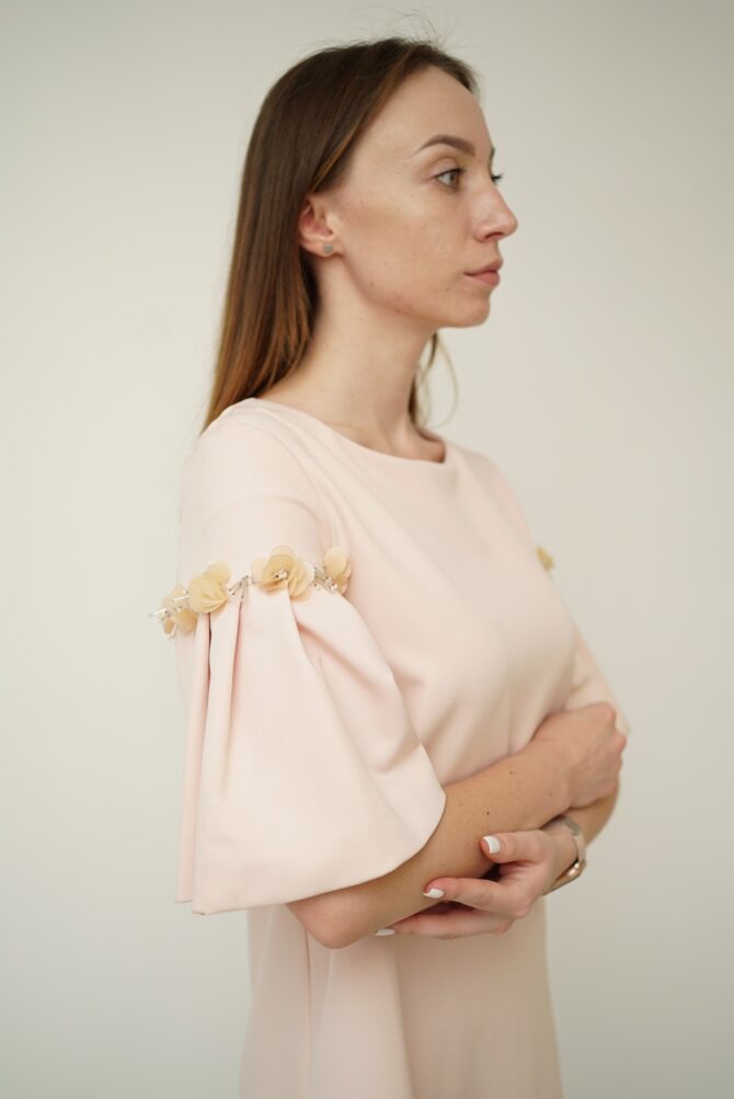 Light pink dress with roses on the sleeves