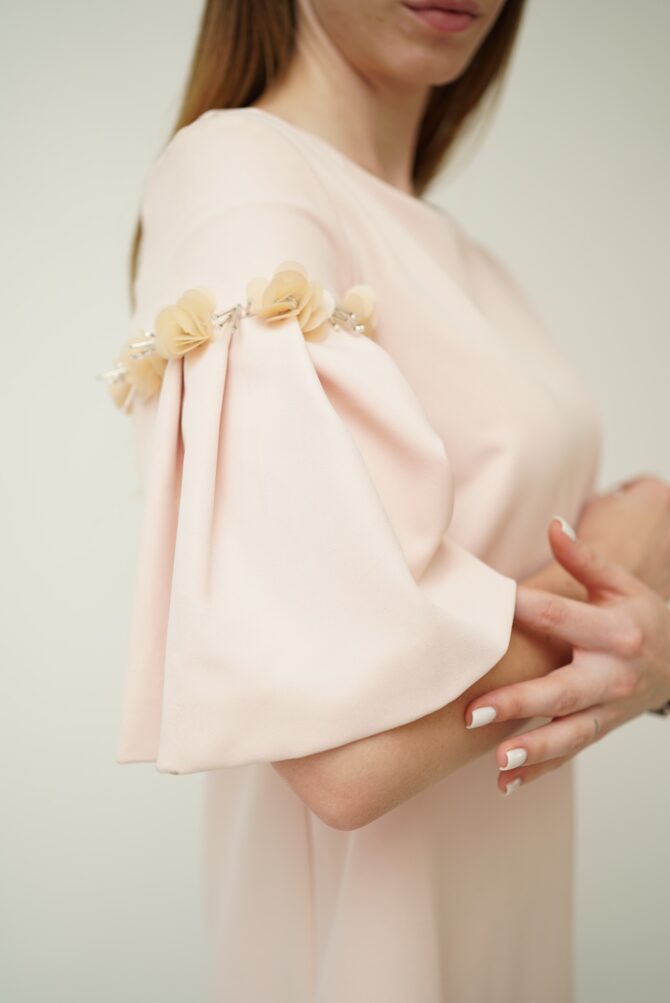 Light pink dress with roses on the sleeves