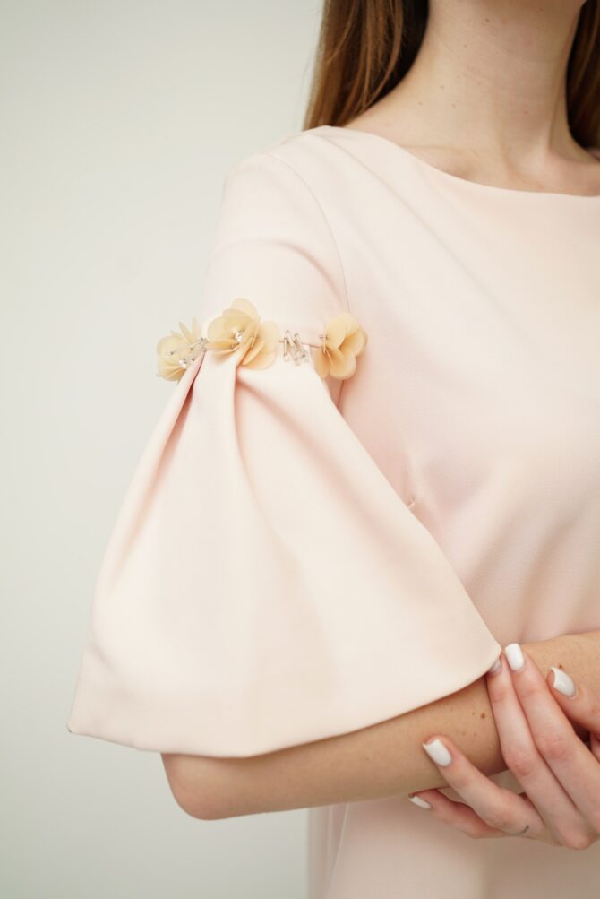 Light pink dress with roses on the sleeves