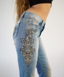 Light jeans with embroidery and rhinestones on the sides and pockets