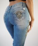 Light jeans with embroidery and rhinestones on the sides and pockets