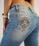 Light jeans with embroidery and rhinestones on the sides and pockets