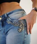 Light jeans with embroidery and rhinestones on the sides and pockets