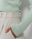 Knitted crop top light mint with long sleeves and ties on the sides