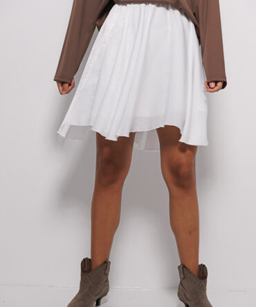 Short white skirt with a wavy hem.