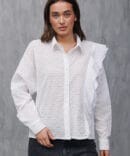 White blouse with ruffle on the side