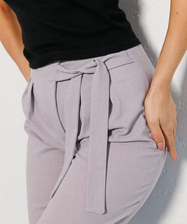 Women's lavender linen pants with an asymmetrical tie at the top