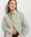 Women's long pistachio shirt with a semicircular bottom