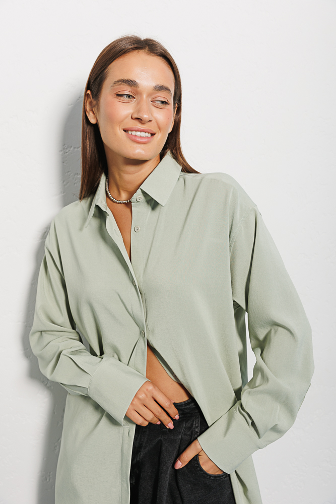 Women's long pistachio shirt with a semicircular bottom