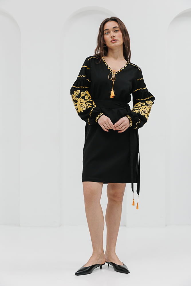 Black short embroidered dress with yellow cross-stitched roses on the sleeves.