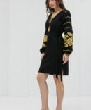 Black short embroidered dress with yellow cross-stitched roses on the sleeves.