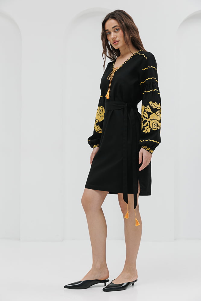 Black short embroidered dress with yellow cross-stitched roses on the sleeves.