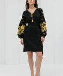 Black short embroidered dress with yellow cross-stitched roses on the sleeves.