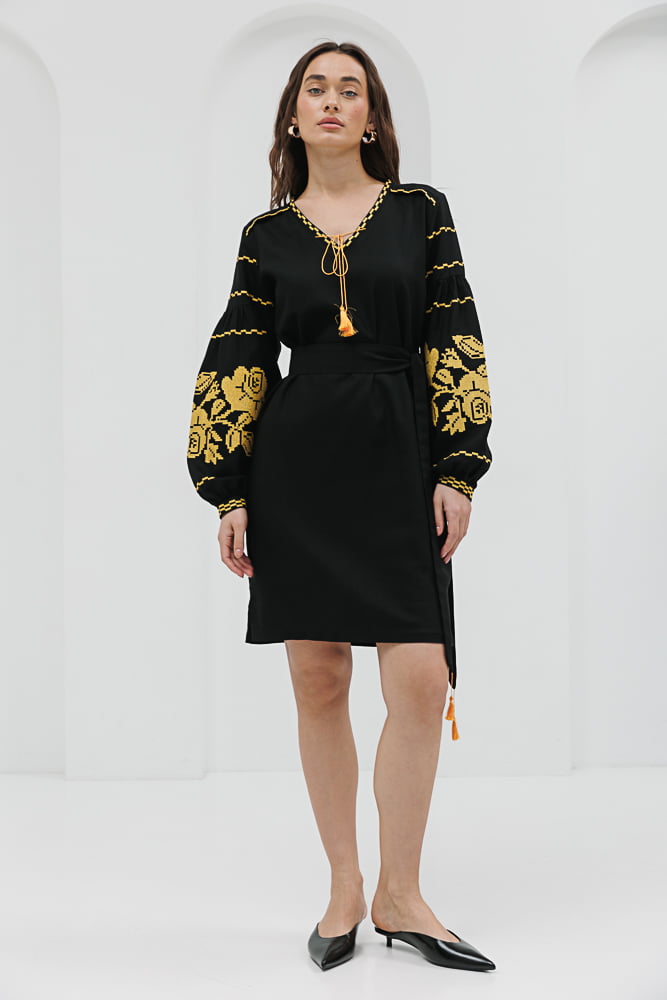 Black short embroidered dress with yellow cross-stitched roses on the sleeves.