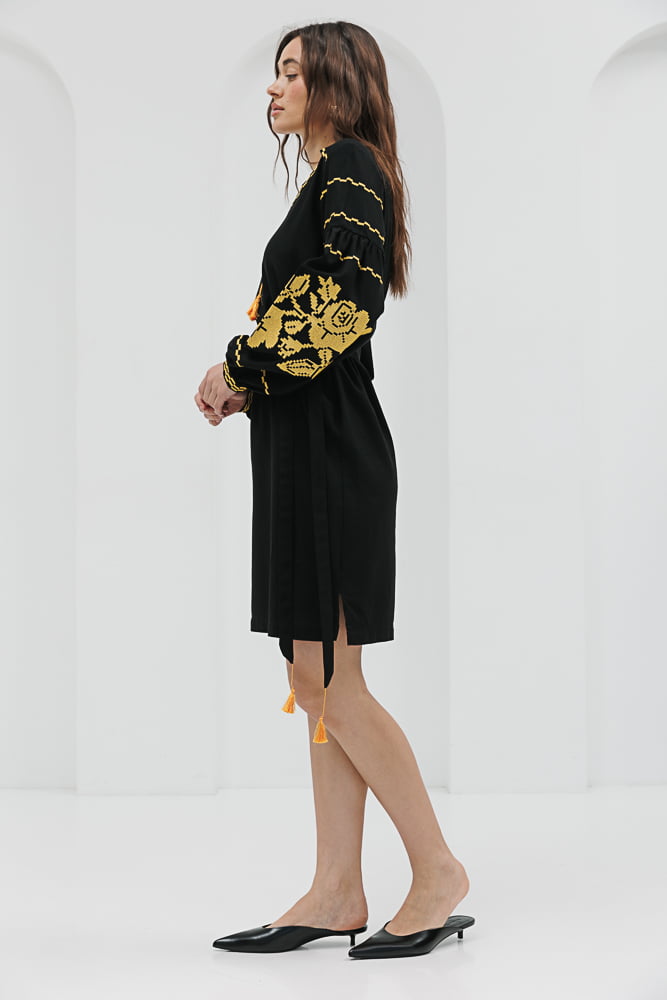 Black short embroidered dress with yellow cross-stitched roses on the sleeves.