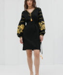 Black short embroidered dress with yellow cross-stitched roses on the sleeves.