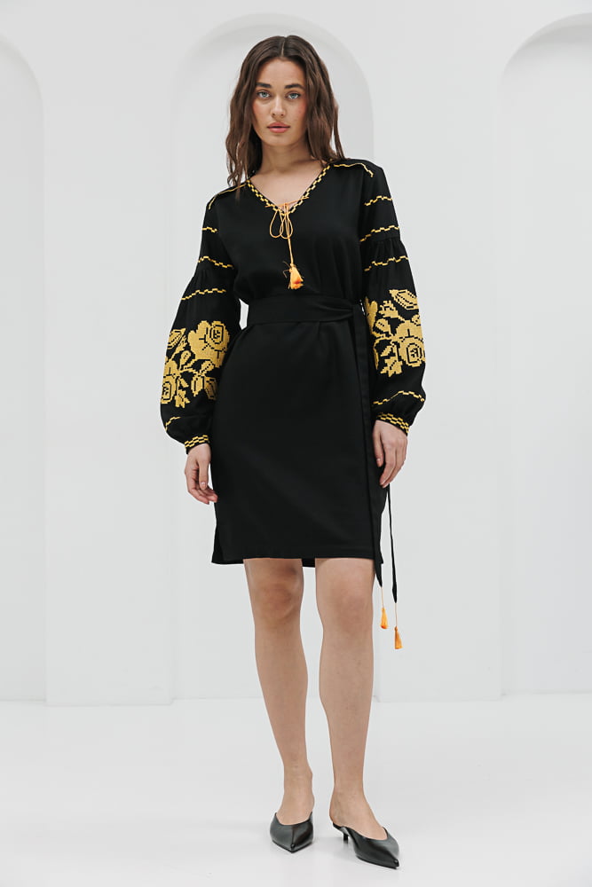 Black short embroidered dress with yellow cross-stitched roses on the sleeves.