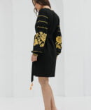 Black short embroidered dress with yellow cross-stitched roses on the sleeves.