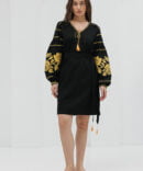 Black short embroidered dress with yellow cross-stitched roses on the sleeves.