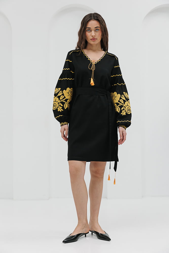 Black short embroidered dress with yellow cross-stitched roses on the sleeves.