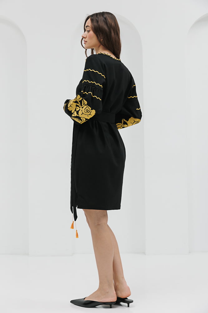 Black short embroidered dress with yellow cross-stitched roses on the sleeves.