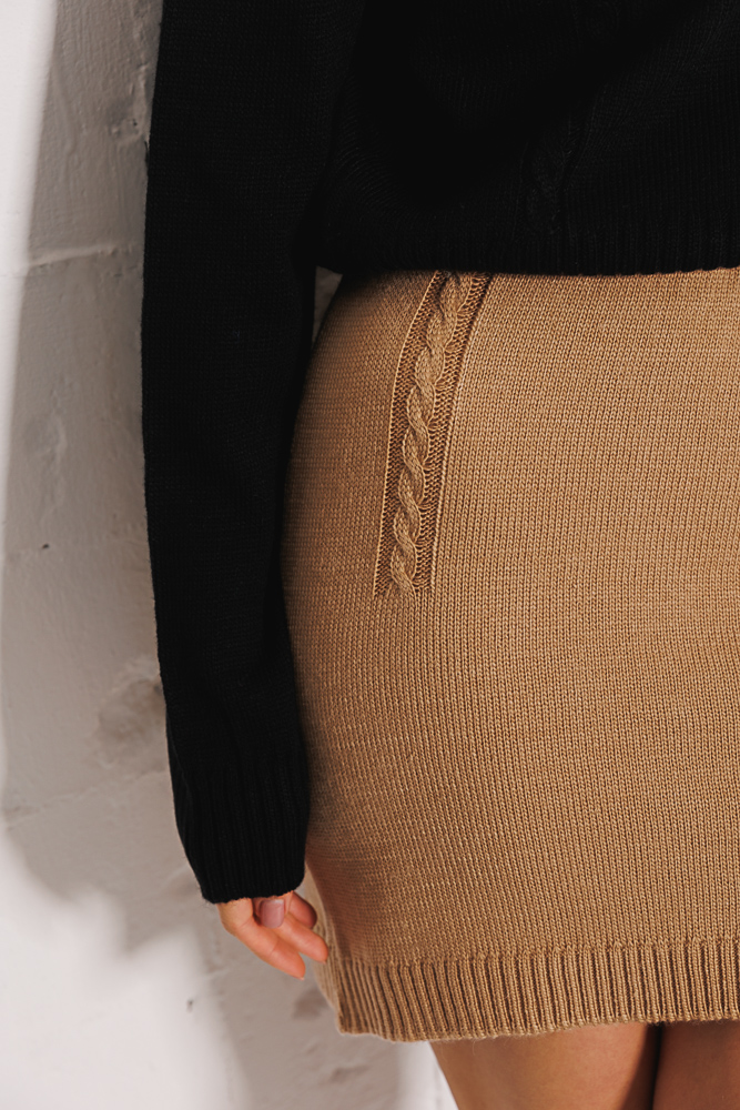 Knitted miniskirt dark beige with pigtails at the top