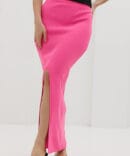 Long pink knit skirt with a front slit.