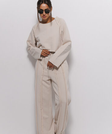 Women's light beige tracksuit with inside-out seams.