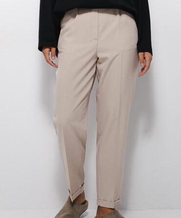 Women's beige slacks with cuffs at the bottom