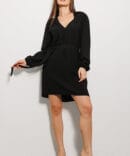 Black short dress with long sleeves.