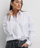 Women's oversize white shirt with a pocket on the chest