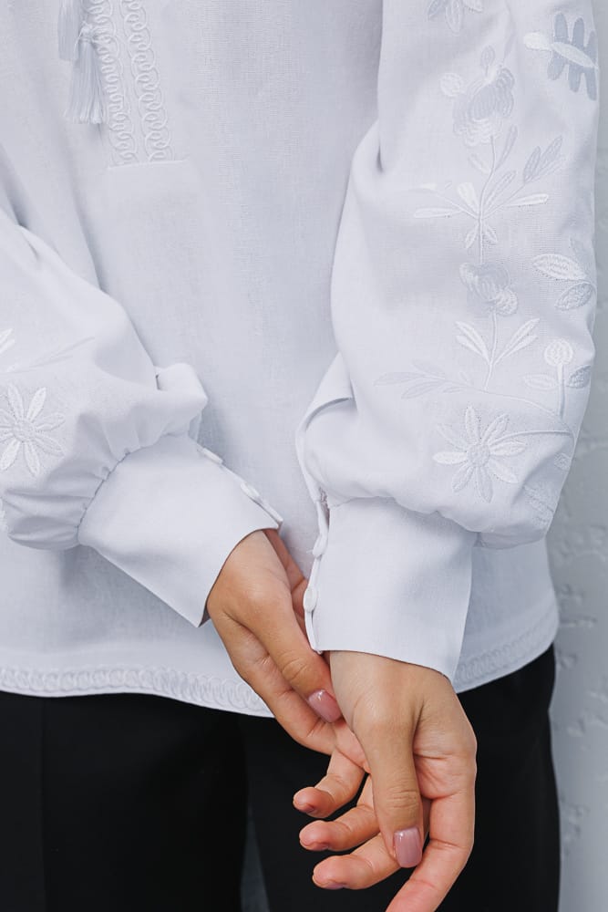 Women's white embroidered shirt with white flowers satin stitch on the sleeves