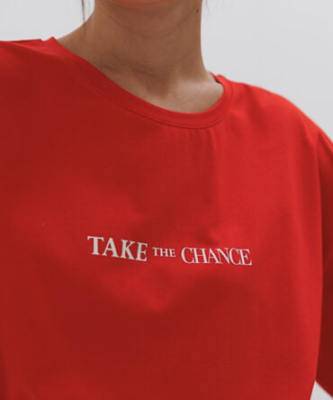 Red women's oversized t-shirt with the "Take the chance" print.