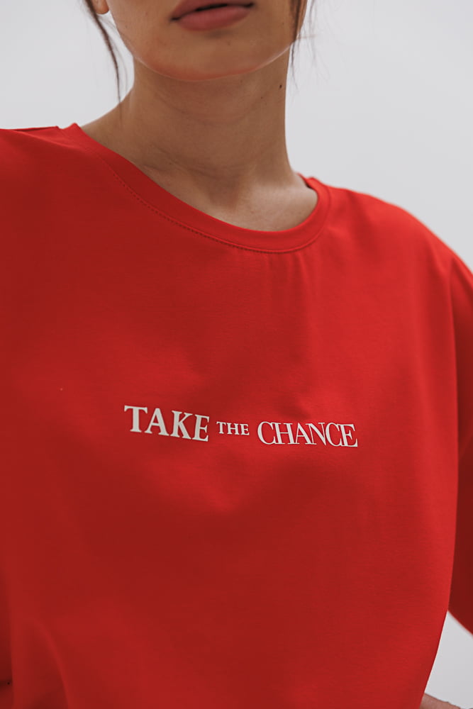 Red women's oversized t-shirt with the "Take the chance" print.