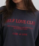 Women's gray sweatshirt with the print "Self Love Club."