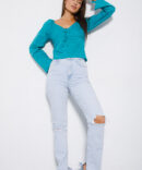 Cropped turquoise blouse with a bow on the chest