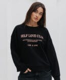 Women's black sweatshirt with the print "Self Love Club."