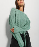 Cropped knitted jumper turquoise with ties at the bottom