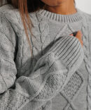 Cropped light grey knit jumper with ties at the bottom.