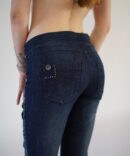 Jeans with embroidery and rhinestones on the sides and buckle