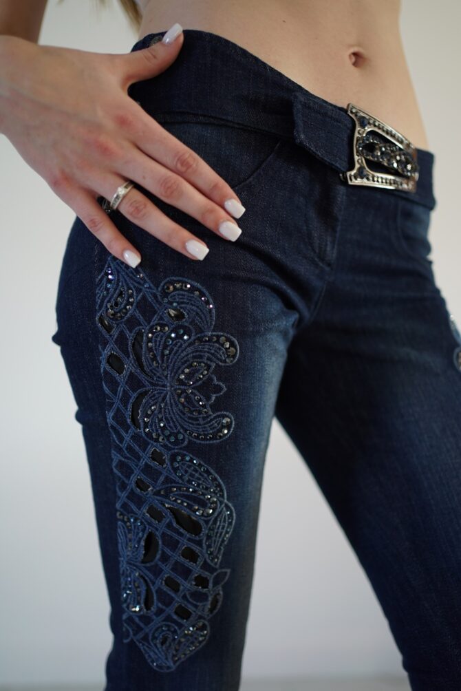 Jeans with embroidery and rhinestones on the sides and buckle