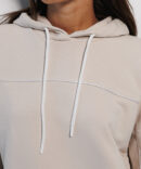 Women's light beige hoodie with white piping.