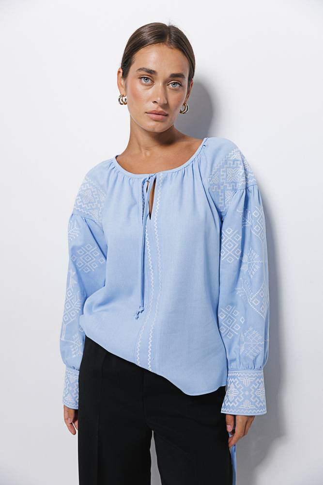 Blue women's embroidered shirt with geometry, satin stitch and ties on the cuffs