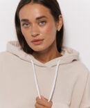 Women's oversized hoodie light beige with a drawstring in the hood